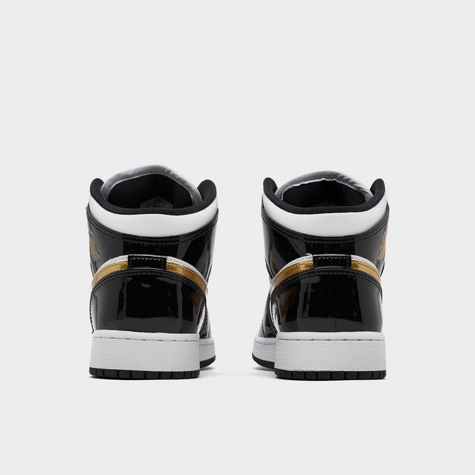 Black and gold kids 2024 jordans