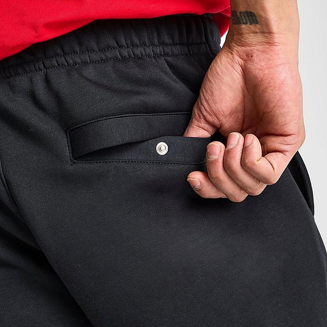 On Model 6 view of Nike Sportswear Club Fleece Cuffed Jogger Pants in Black/Black/White Click to zoom