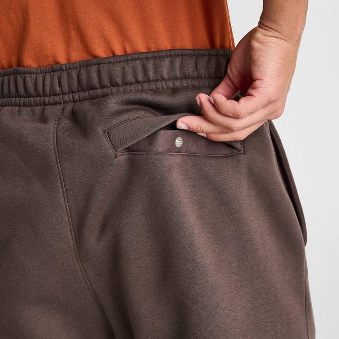 Nike Collection Fleece loose-fit cuffed sweatpants in dark brown