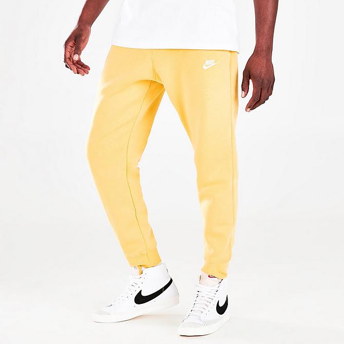 Front Three Quarter view of Nike Sportswear Club Fleece Cuffed Jogger Pants in Saturn Gold/Saturn Gold/White Click to zoom