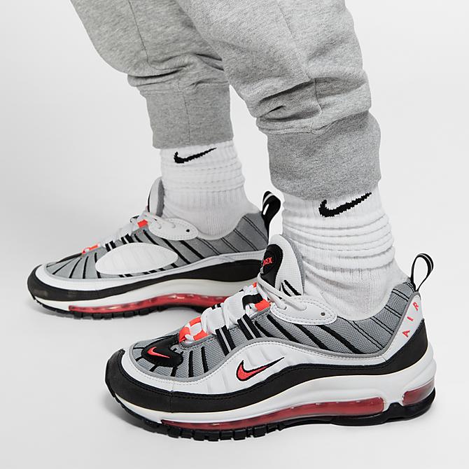 On Model 5 view of Women's Nike Sportswear Essential Jogger Pants in Grey/White Click to zoom