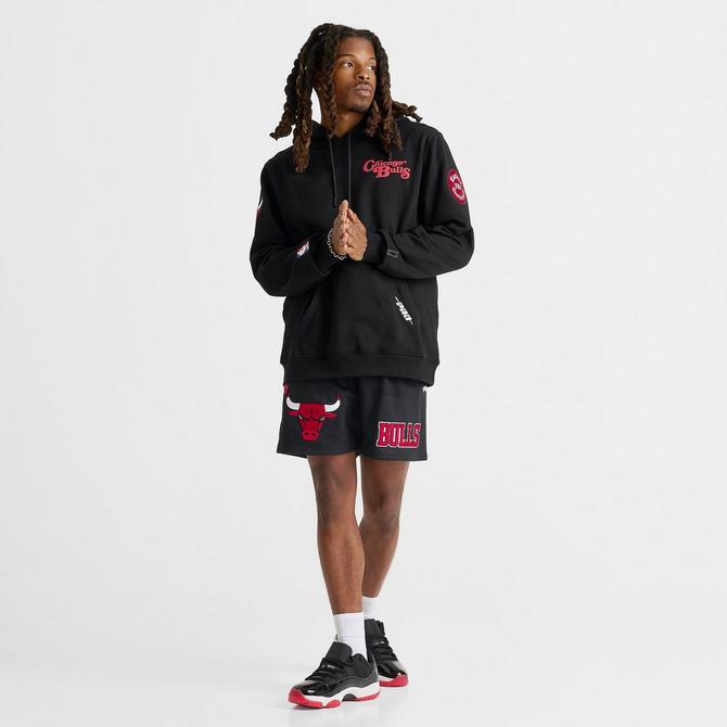 [angle] view of Men's Pro Standard Chicago Bulls NBA Souvenir Fleece Pullover Hoodie in Black/Red Click to zoom