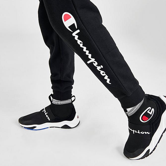 On Model 6 view of Kids' Champion Script French Terry Jogger Pants in Black Click to zoom