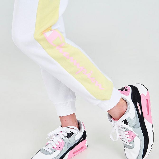On Model 6 view of Girls' Champion Smiley Script Logo Jogger Pants in White/Pink/Yellow Click to zoom