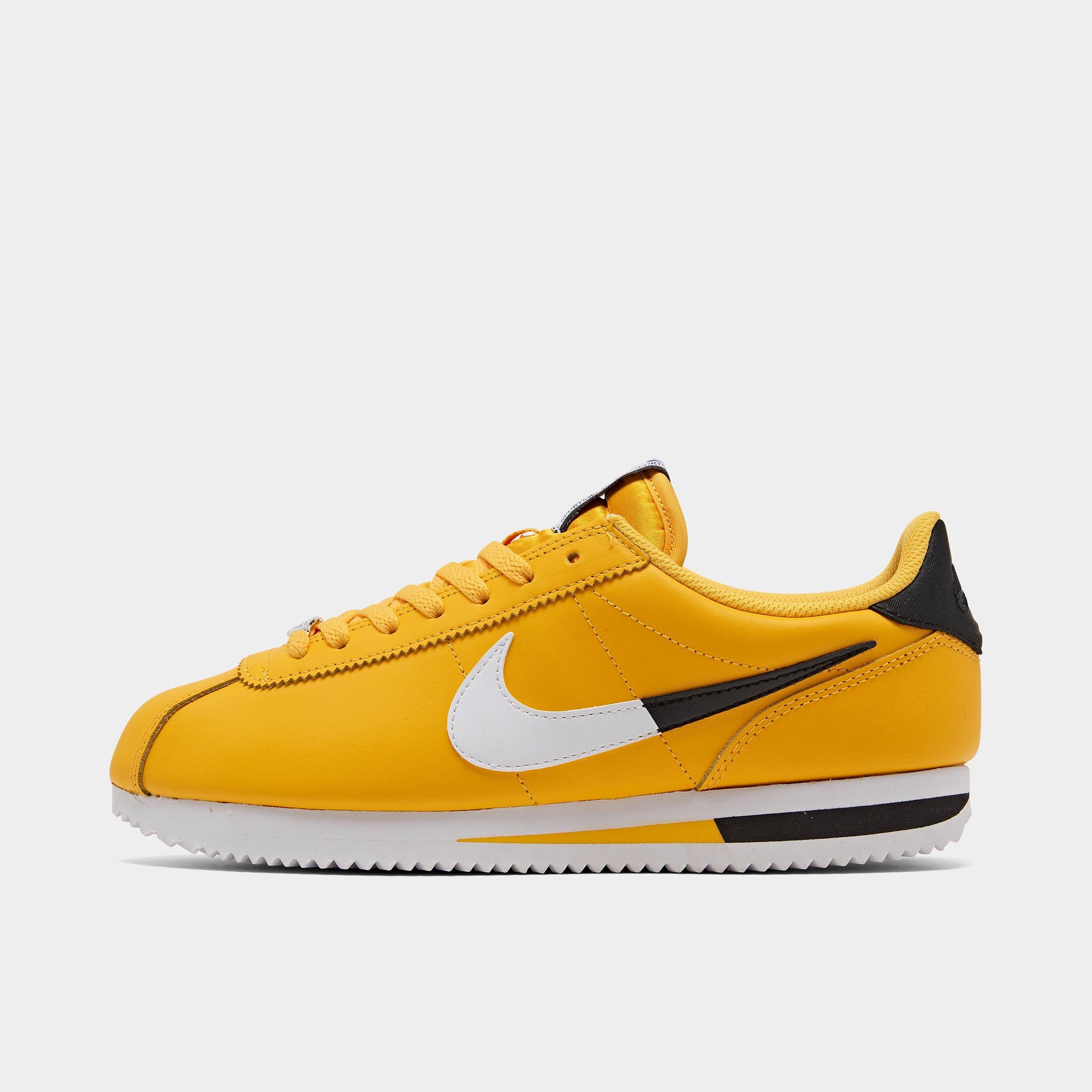 black and yellow nike cortez