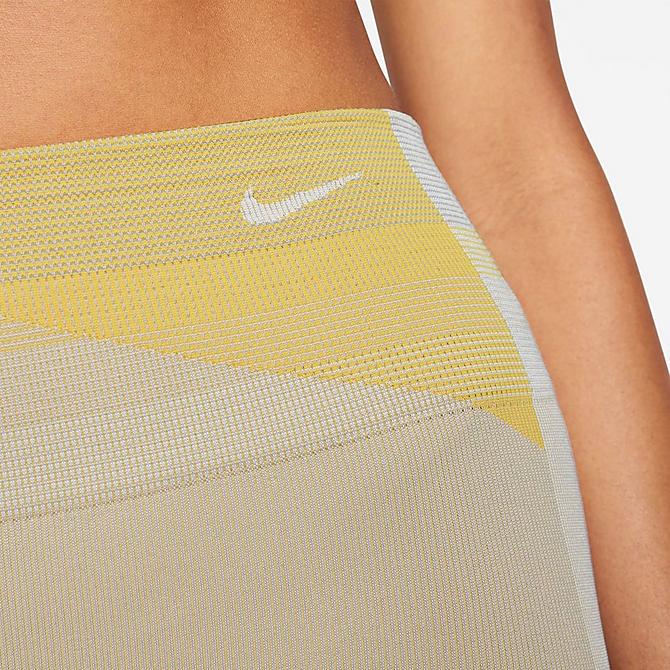 Back Right view of Women's Nike Sculpt Icon Clash Crop Running Tights in Pale Ivory/Shimmer/Laser Orange/Pale Ivory Click to zoom