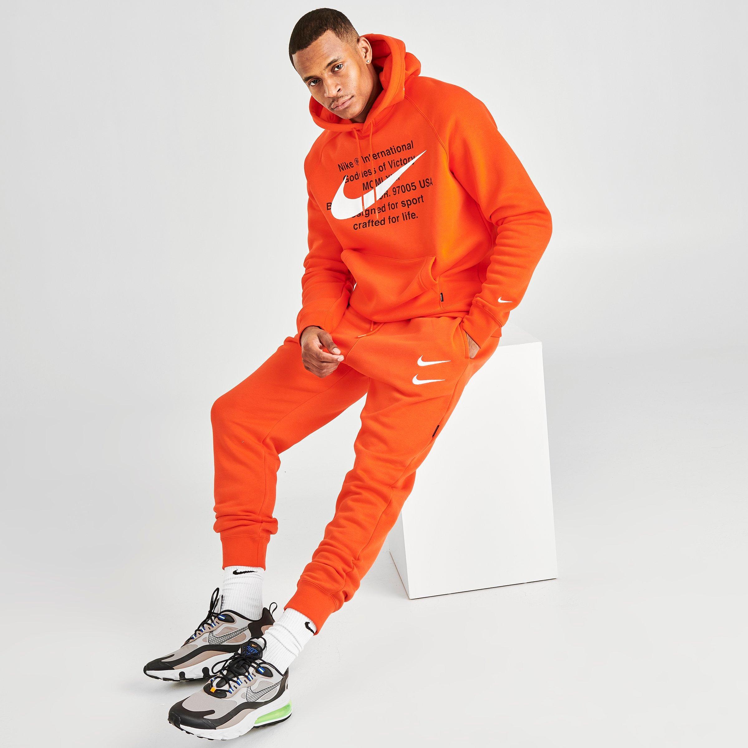 orange nike sweats