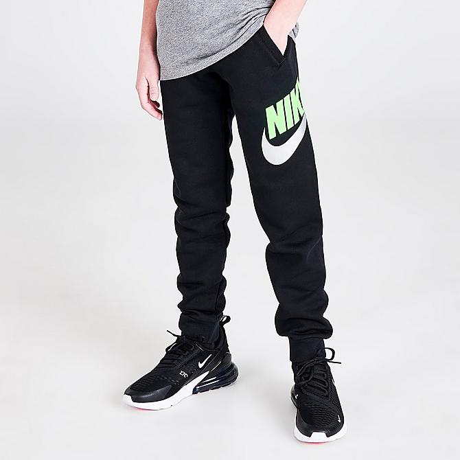 Front Three Quarter view of Kids' Nike Sportswear Club Fleece Jogger Pants in Black/Green Strike Click to zoom