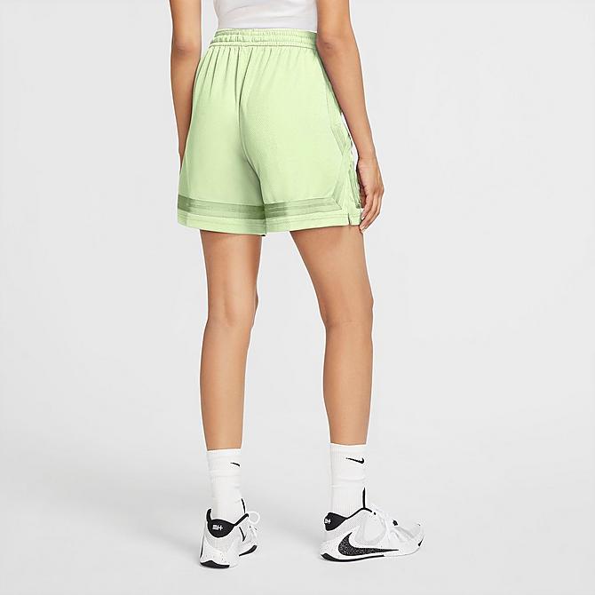 Front Three Quarter view of Women's Nike Dri-FIT Swoosh Fly Sisterhood Basketball Shorts in Lime Ice/Flat Gold Click to zoom