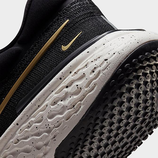 Front view of Men's Nike ZoomX Invincible Run Flyknit Running Shoes in Black/Metallic Gold/Sail Click to zoom
