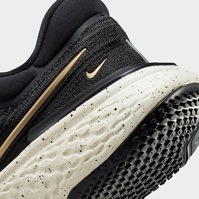 Front view of Women's Nike ZoomX Invincible Run Flyknit Running Shoes in Black/Sail/Metallic Gold Click to zoom