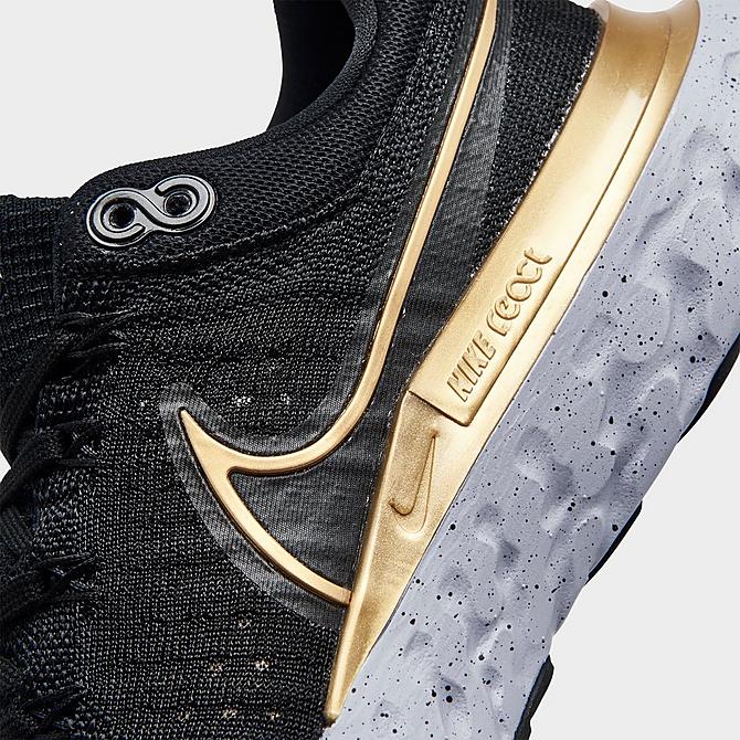 Front view of Women's Nike React Infinity Run Flyknit 2 Running Shoes in Black/Metallic Gold/Ghost/Dark Smoke Grey Click to zoom