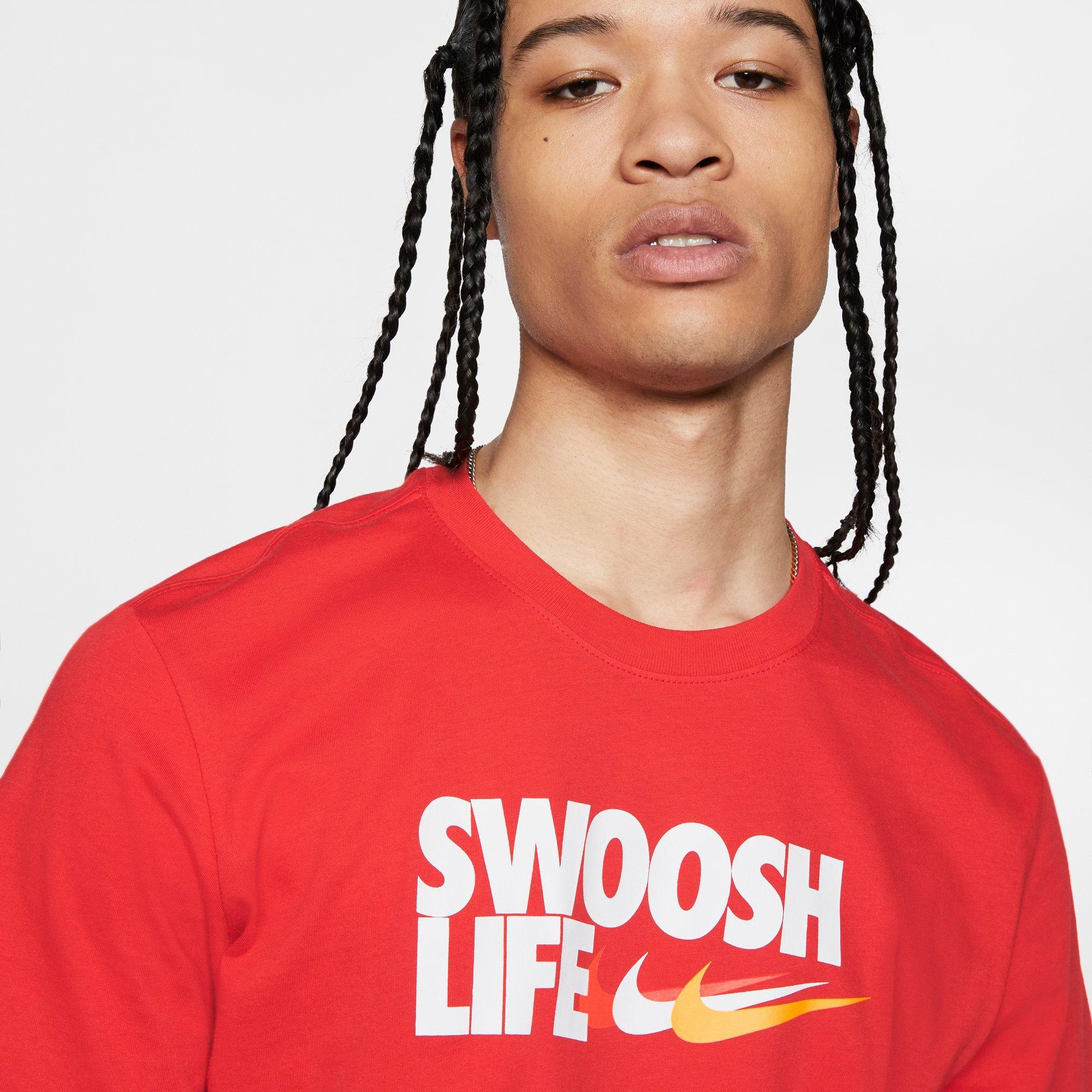 black nike shirt with red swoosh