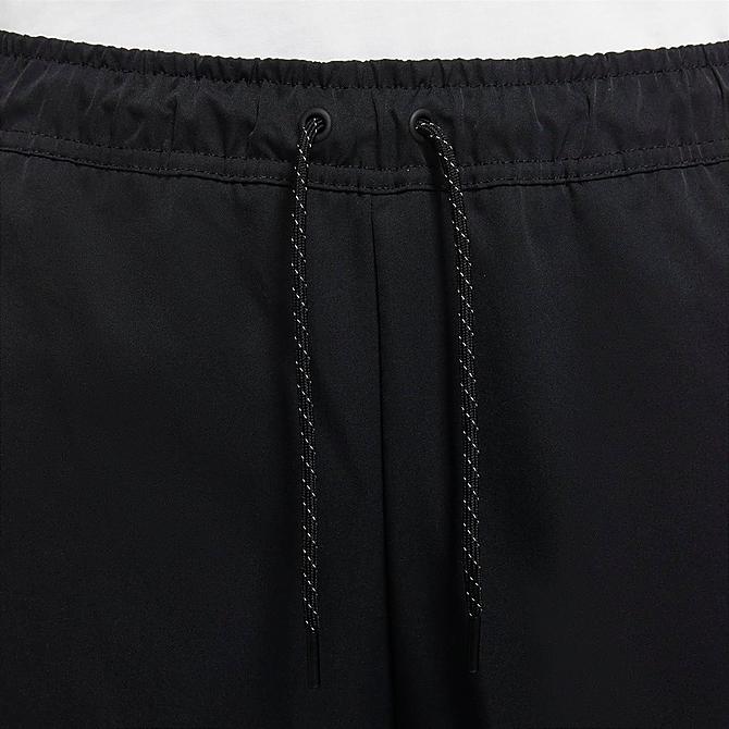 Back Right view of Men's Nike Sportswear Woven Sweatpants in Black/Black Click to zoom
