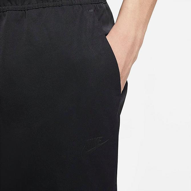 On Model 5 view of Men's Nike Sportswear Woven Sweatpants in Black/Black Click to zoom