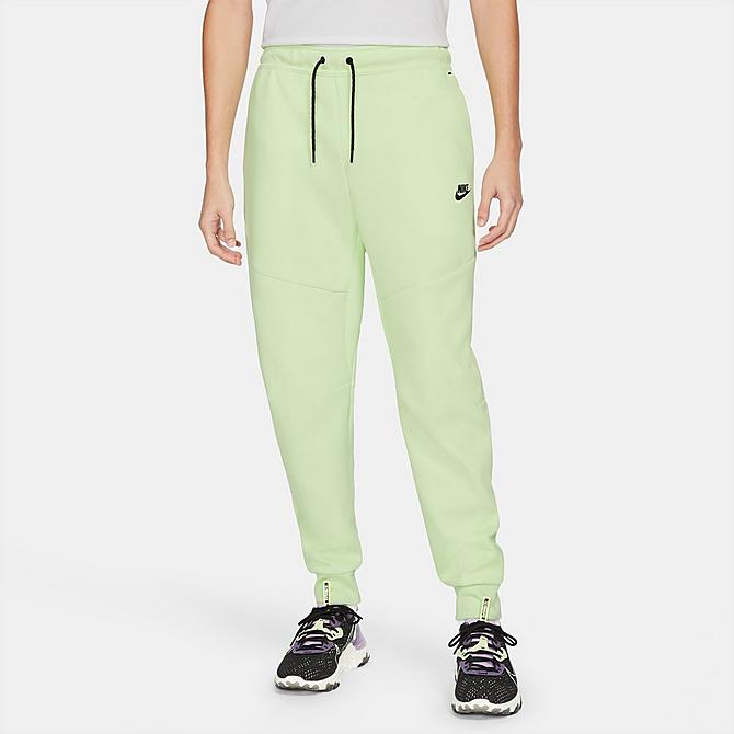 Front Three Quarter view of Nike Tech Fleece Taped Jogger Pants in Light Liquid Lime/Black Click to zoom