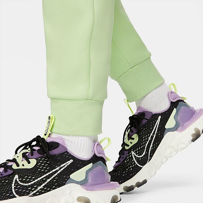 On Model 6 view of Nike Tech Fleece Taped Jogger Pants in Light Liquid Lime/Black Click to zoom