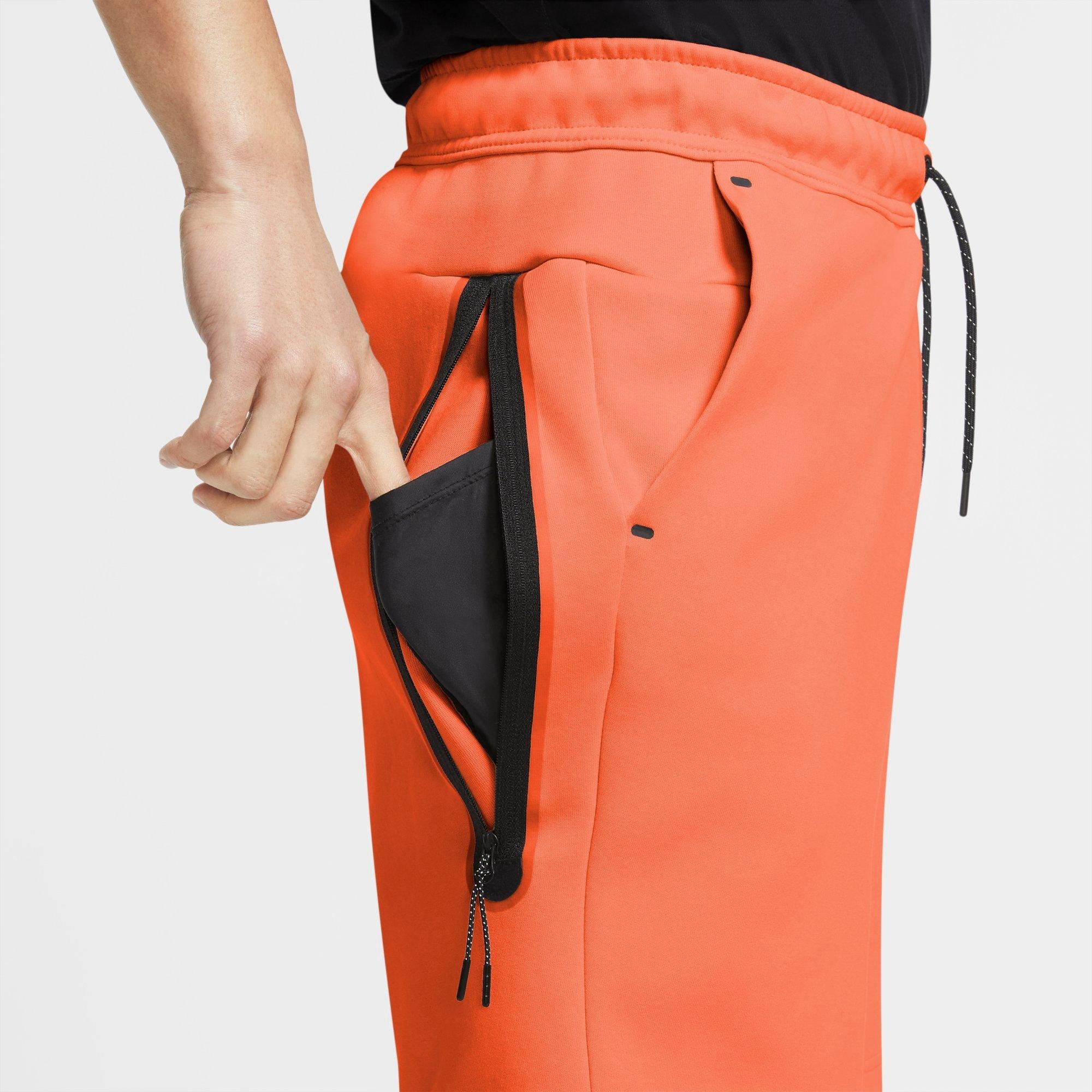 orange nike tech fleece pants