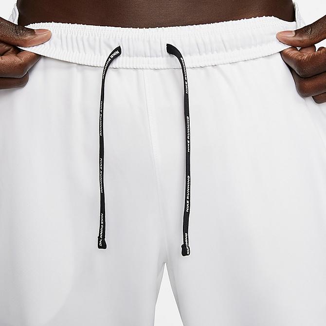On Model 5 view of Men's Nike Essential Woven Running Pants in White/White/Reflective Silver Click to zoom