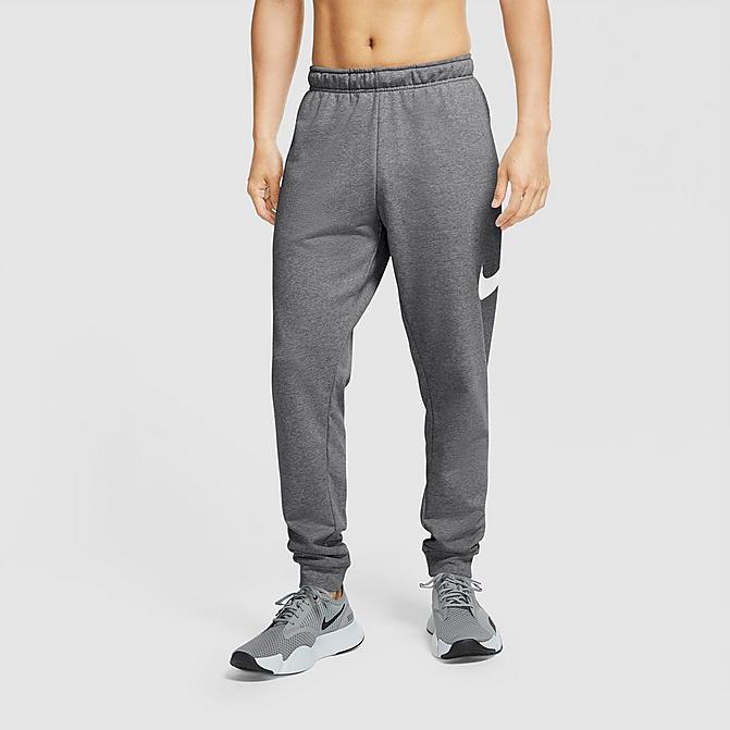 Front view of Men's Nike Dri-FIT Futura Swoosh Tapered Jogger Pants in Charcoal Heather/White Click to zoom