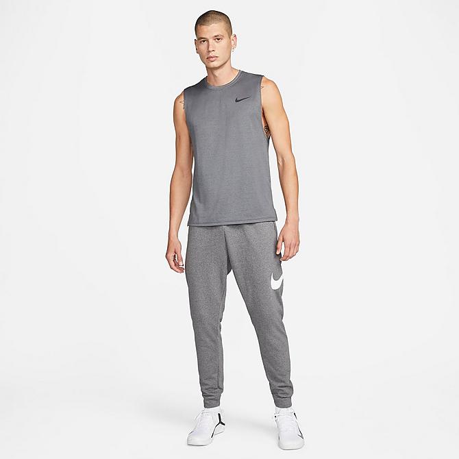 Back Left view of Men's Nike Dri-FIT Futura Swoosh Tapered Jogger Pants in Charcoal Heather/White Click to zoom