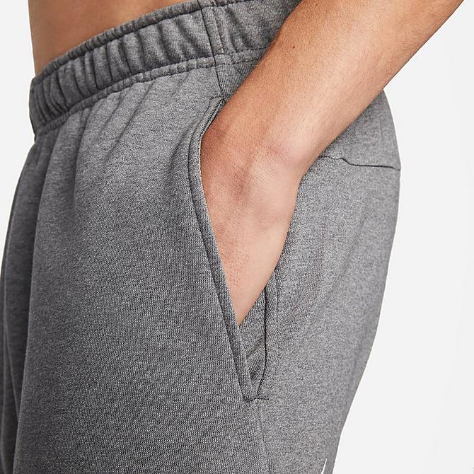 Back Right view of Men's Nike Dri-FIT Futura Swoosh Tapered Jogger Pants in Charcoal Heather/White Click to zoom