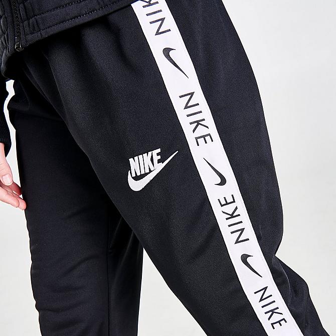 On Model 5 view of Girls' Nike Sportswear Taped Track Suit in Black/White Click to zoom