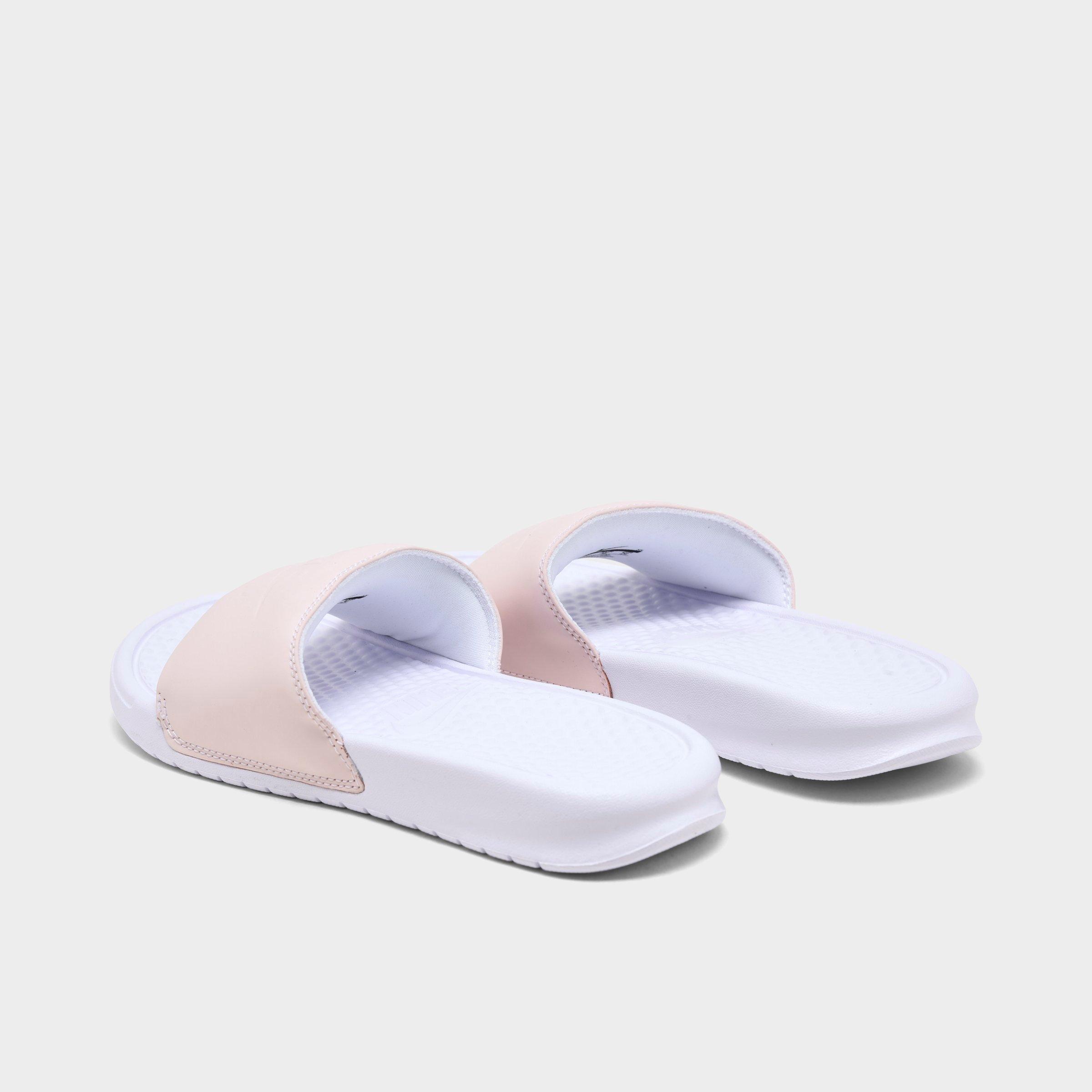 pink and white nike sandals