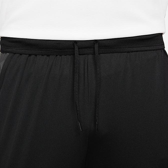 On Model 5 view of Men's Nike Dri-FIT Strike Soccer Pants in Black/Anthracite/White/White Click to zoom
