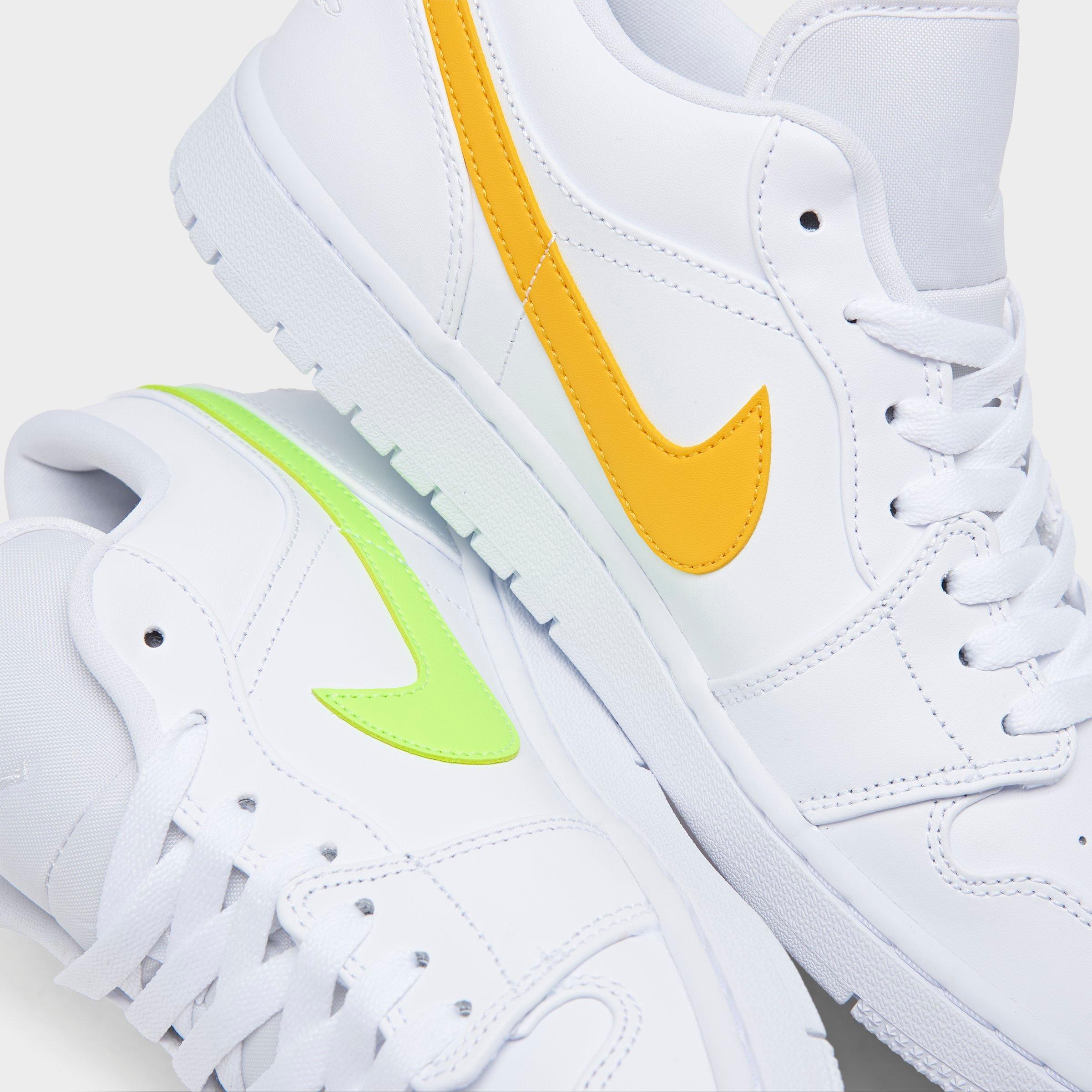 white nike shoes with colored swoosh