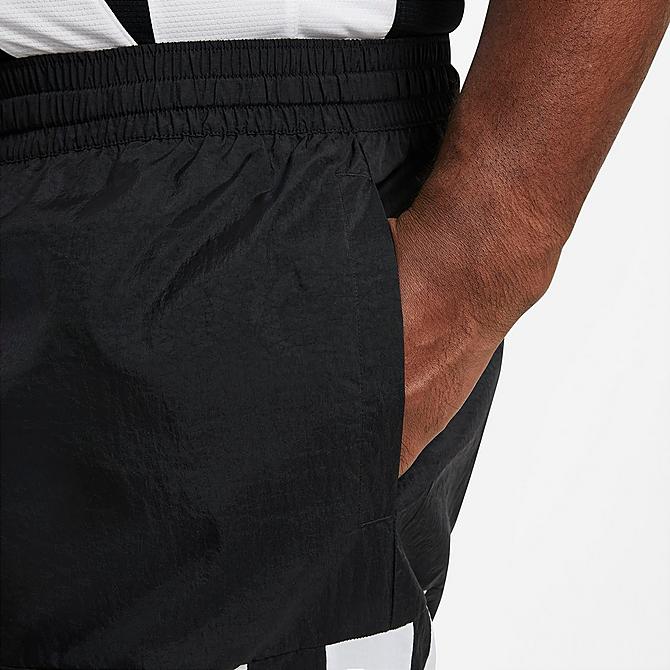 On Model 5 view of Men's Nike Dri-FIT Starting 5 Basketball Pants in Black/Black/Black/White Click to zoom