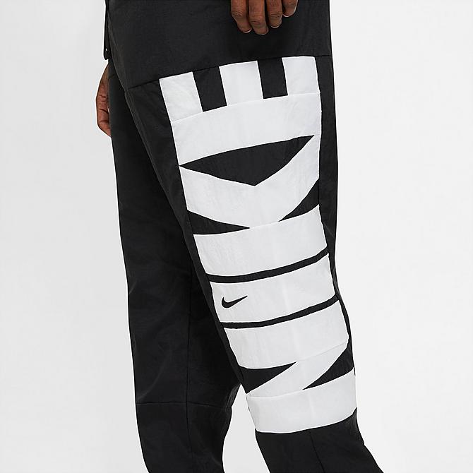 On Model 6 view of Men's Nike Dri-FIT Starting 5 Basketball Pants in Black/Black/Black/White Click to zoom