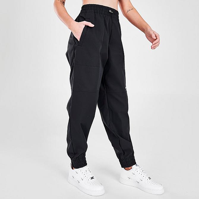 Back Left view of Women's Nike Sportswear Swoosh Woven Jogger Pants in Black Click to zoom
