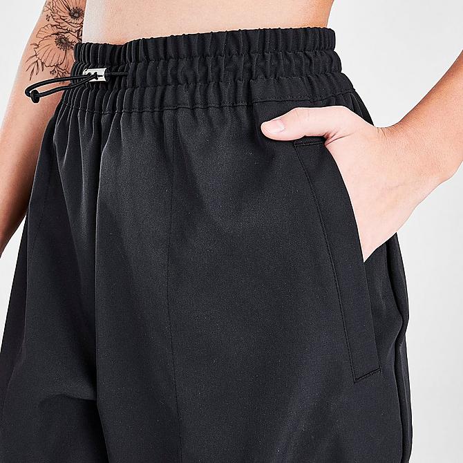 On Model 5 view of Women's Nike Sportswear Swoosh Woven Jogger Pants in Black Click to zoom