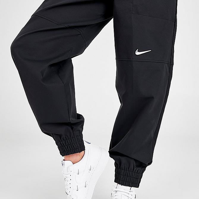 On Model 6 view of Women's Nike Sportswear Swoosh Woven Jogger Pants in Black Click to zoom