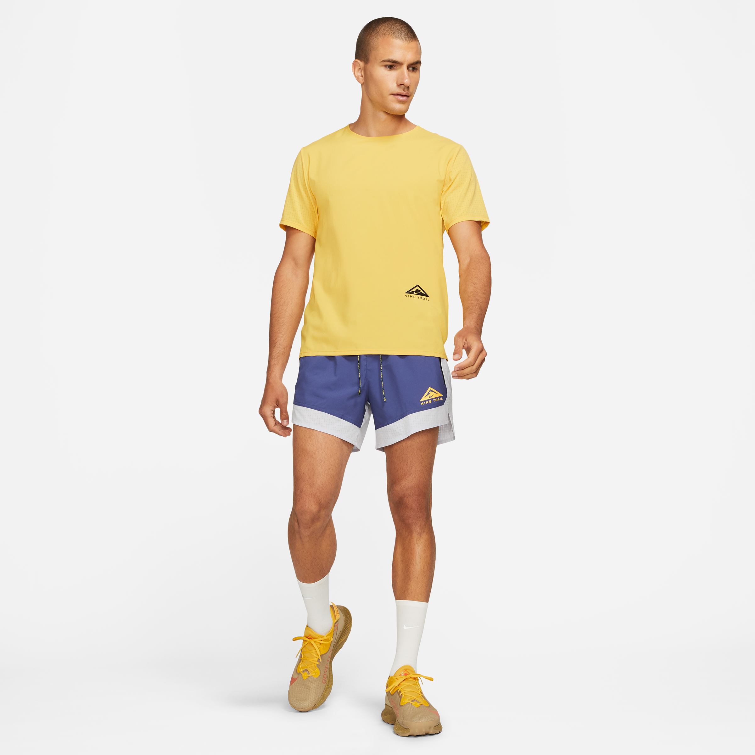 nike trail shorts yellow