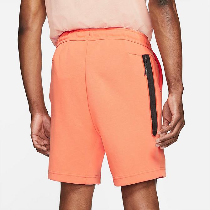 Back Right view of Men's Nike Sportswear Washed Tech Fleece Shorts in Orange Frost/Black Click to zoom