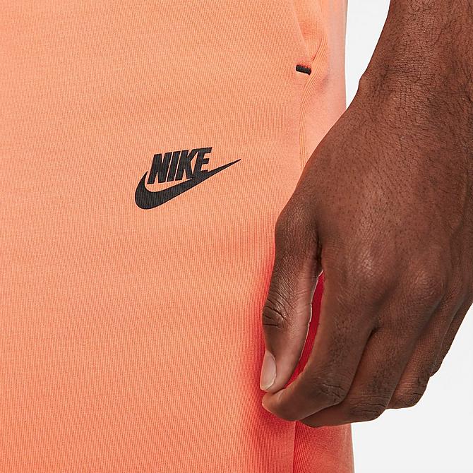 On Model 5 view of Men's Nike Sportswear Washed Tech Fleece Shorts in Orange Frost/Black Click to zoom
