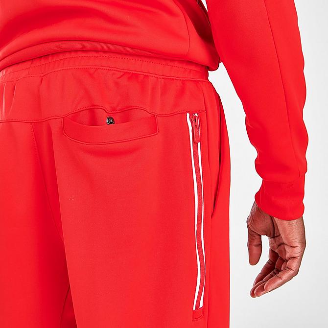 On Model 6 view of Men's Nike Sportswear Tribute Jogger Pants in University Red/White Click to zoom