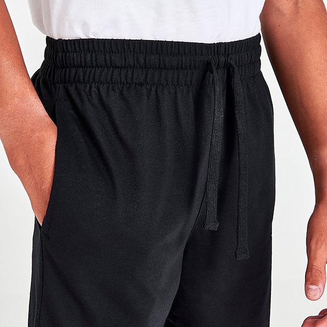 On Model 6 view of Boys' Nike Sportswear Jersey Shorts in Black/White/White Click to zoom