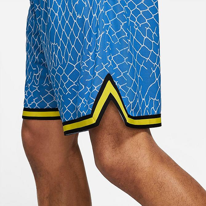 On Model 5 view of Men's Nike DNA Seasonal Graphic Basketball Shorts in Signal Blue/Light Smoke Grey/Black Click to zoom