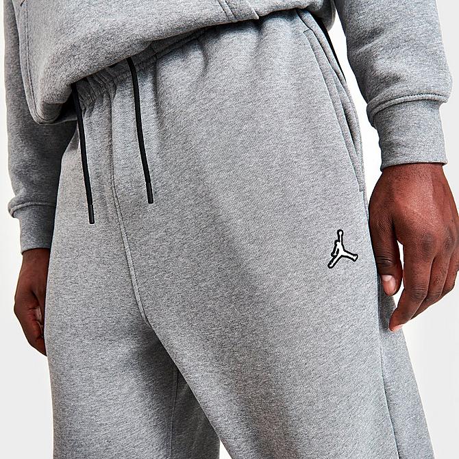 On Model 5 view of Men's Jordan Essentials Fleece Pants in Carbon Heather Click to zoom
