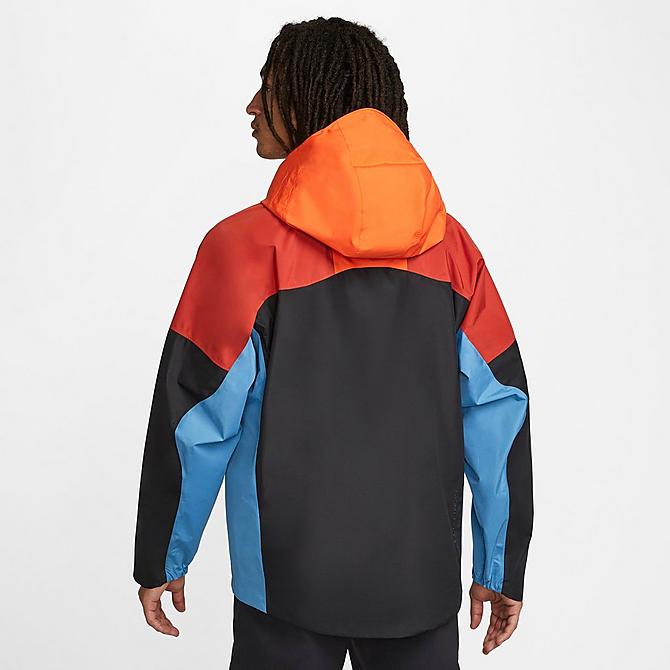 Front Three Quarter view of Men's Nike Storm-FIT ADV ACG "Chain of Craters" Hiking Jacket in Rush Orange/Black/Summit White Click to zoom