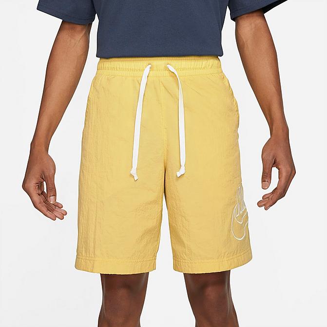 Front view of Men's Nike Sportswear Alumni Woven Shorts in Saturn Gold Click to zoom
