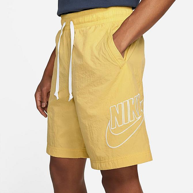 Back Right view of Men's Nike Sportswear Alumni Woven Shorts in Saturn Gold Click to zoom