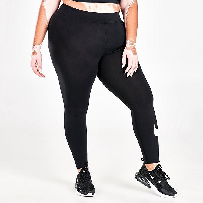 Back Left view of Women's Nike Sportswear Essential Mid-Rise Cropped Swoosh Leggings (Plus Size) in Black/White Click to zoom