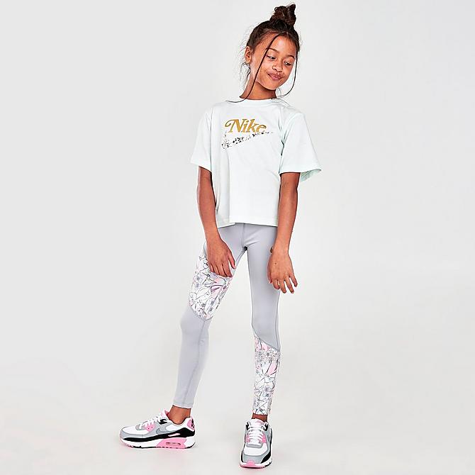 Front Three Quarter view of Girls' Nike Dri-FIT One Femme Leggings in Light Smoke Grey/Multi-Color/Metallic Gold Click to zoom