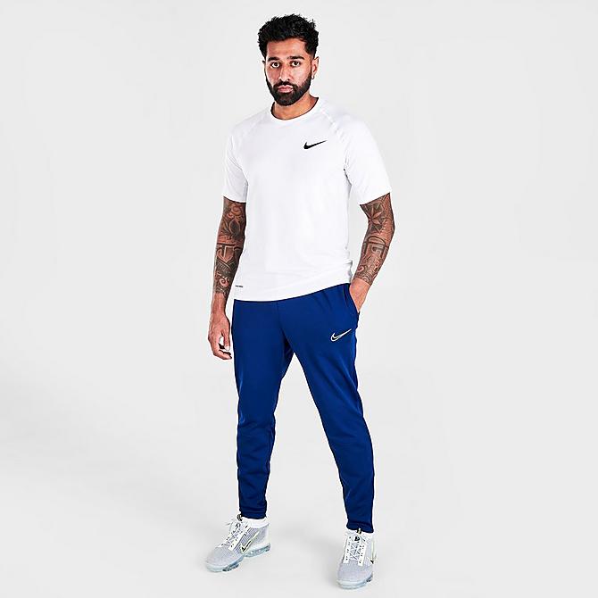 Front Three Quarter view of Men's Nike Therma-FIT Academy Winter Warrior Soccer Training Pants in Blue Void/Volt Click to zoom