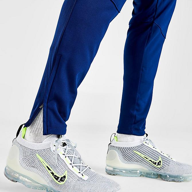 On Model 6 view of Men's Nike Therma-FIT Academy Winter Warrior Soccer Training Pants in Blue Void/Volt Click to zoom