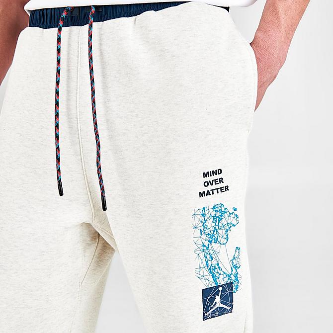 On Model 5 view of Men's Jordan Essentials Mountainside Graphic Pants in Oatmeal Heather Click to zoom